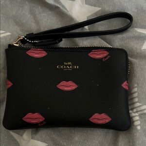 Coach Black Wristlet with Pink Lip Motif